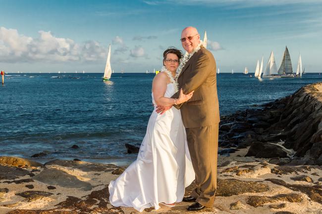 Couple with boats in the ocean