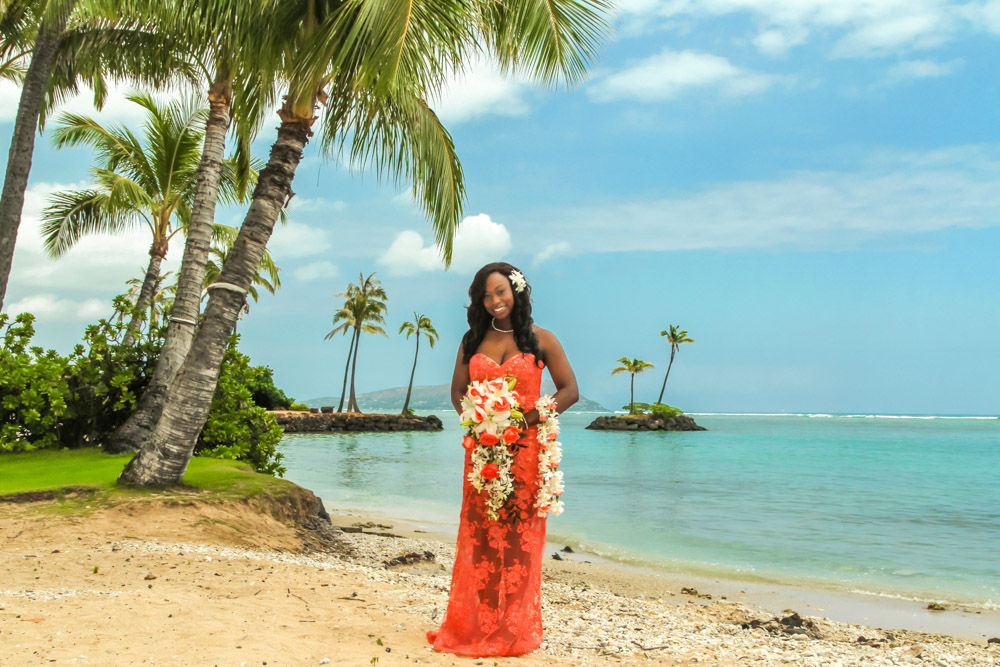 Bride with flowers on the beach