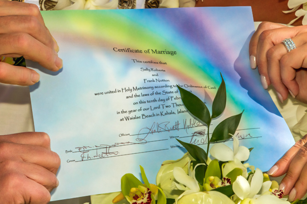 Marriage Keepsake held by couple and their friends